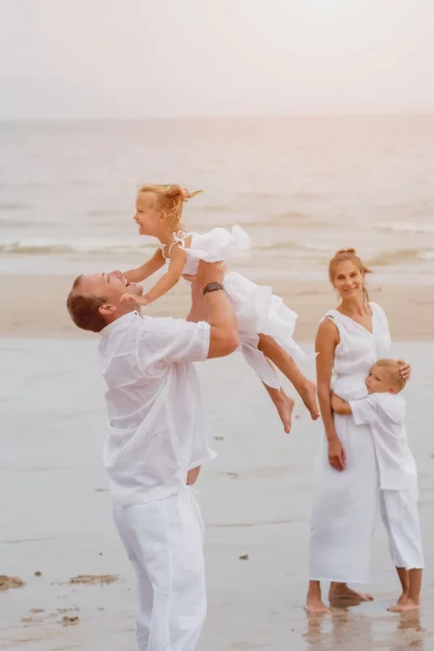 happy-young-family-sunset-beach